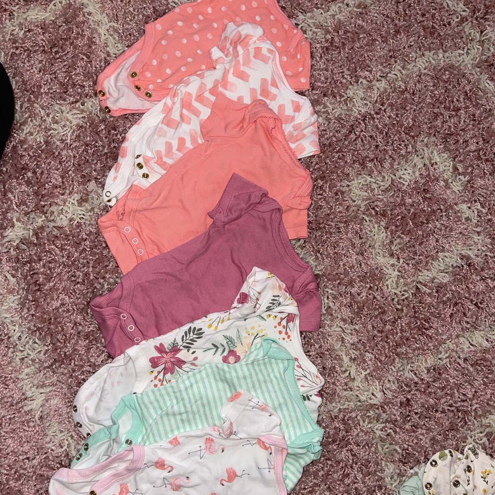 Never worn newborn onesies